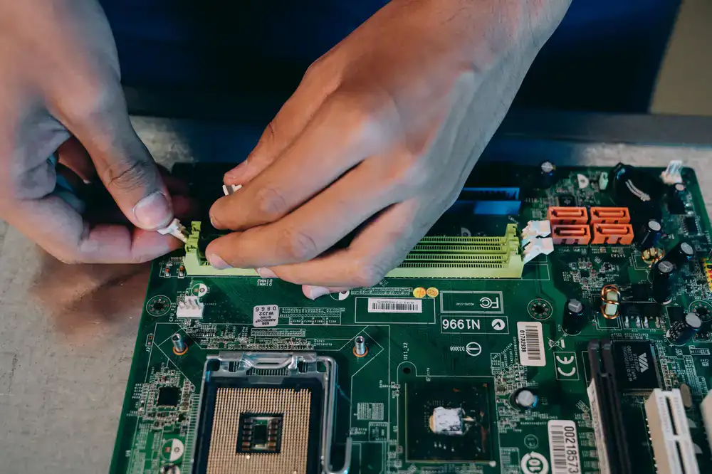 Technician working on a custom gaming PC motherboard